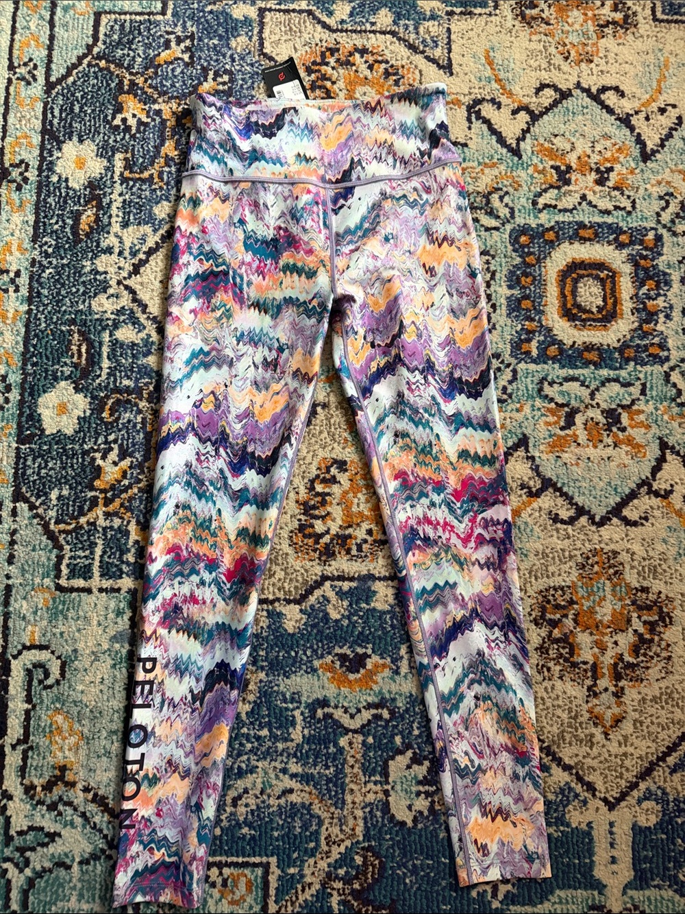 Peloton women’s Purple Pink Teal Orange Wave Print Leggings